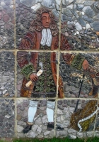 An eighteenth century courtier stands against the background of slate, stone, pebbles and aggregate. - click to enlarge An eighteenth century courtier stands against the background of slate, stone, pebbles and aggregate.