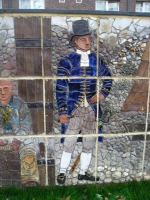 A midshipman and mariner from the Age of sail. The midshipman, holding a spyglass in his hand, carries a ceremonial sword. - click to enlarge A midshipman and mariner from the Age of sail. The midshipman, holding a spyglass in his hand, carries a ceremonial sword.