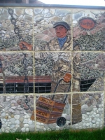 A docker, now as much part of history as the figures from the 18th and 19th centuries. This photo was taken of the mural in its new position in a small park opposite the original hospital. Grass now grows beneath the figures and open sky can be seen behind. - click to enlarge A docker, now as much part of history as the figures from the 18th and 19th centuries. This photo was taken of the mural in its new position in a small park opposite the original hospital. Grass now grows beneath the figures and open sky can be seen behind.