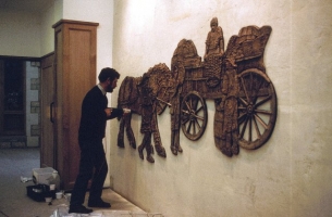 Kennedy is fixing the left horse after the centre section with the cart has been positioned first.
