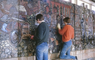 My helpers clean spilled render from the mural surface. There is always cleaning to do when cement has been used. - click to enlarge My helpers clean spilled render from the mural surface. There is always cleaning to do when cement has been used.