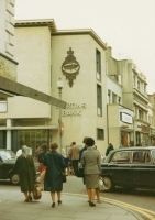 Shoppers and cars well represent the decade in which this panel was installed.