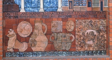 Artefacts found during archaeological excavations on the Guildhall site.  From the left � a pottery lion-jug, a Roman coin, a �Bellarmine� jug (with a face applied to the front, originally that of Cardinal Bellarmine,) two pieces of plaster work, a mediaeval storage jar and the wood block used in the 18th century to print wool sacks with their identity.