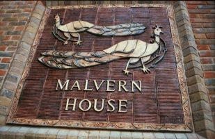 Peacocks watermark panel on Malvern House.