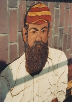 A close up of W. G. Grace in position on the building.