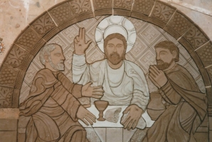 Suuper at Emmaus modelled in clay with slips applied before a kiln firing.