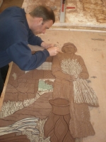 Cutting in the farm labourer into the rest of the modelled clay