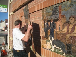 Fitting the panels onto the new Waitrose store wall