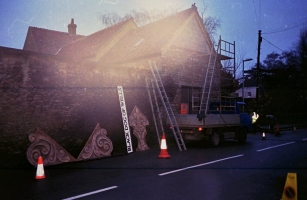 A grainy scanned negative of the panels about to go up